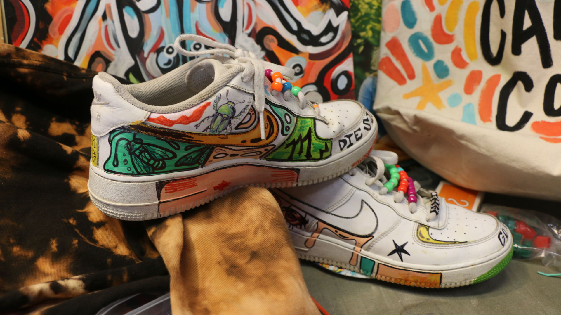 A pair of sneakers sit on top of each other
